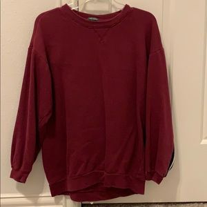 a maroon crew neck